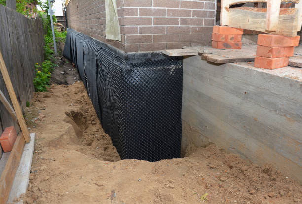 Happy homeowners after waterproofing job in White Post